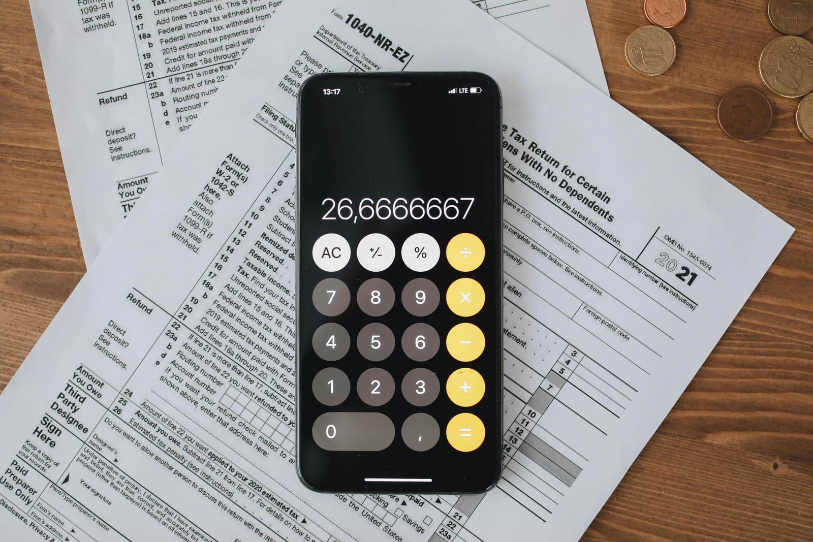 A calculator and some papers on a table